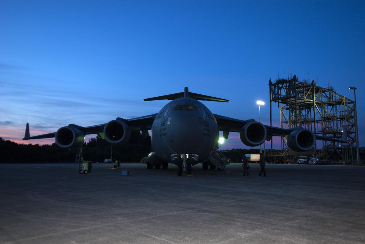 CAPE CANAVERAL, Fla. – A C-17 aircraft carrying the MAVEN spacecraft stops on the Shuttle Landing Facility parking apron at NASA's Kennedy Space Center in Florida. The aircraft is delivering MAVEN for processing ahead of a launch later this year on a United Launch Alliance Atlas V rocket. MAVEN, short for Mars Atmosphere and Volatile Evolution, will orbit Mars to study the Red Planet's upper atmosphere in unprecedented detail. Photo credit: NASA/Tim Jacobs