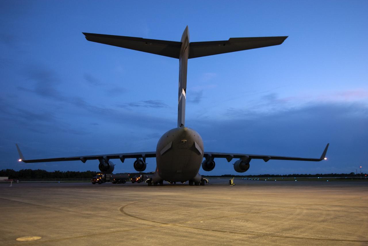 CAPE CANAVERAL, Fla. – A C-17 aircraft carrying the MAVEN spacecraft has arrived at the Shuttle Landing Facility at NASA's Kennedy Space Center in Florida. The aircraft is delivering MAVEN for processing ahead of a launch later this year on a United Launch Alliance Atlas V rocket. MAVEN, short for Mars Atmosphere and Volatile Evolution, will orbit Mars to study the Red Planet's upper atmosphere in unprecedented detail. Photo credit: NASA/Tim Jacobs