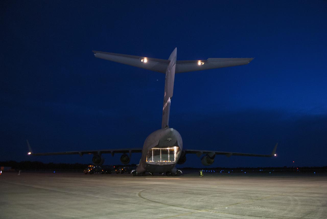 CAPE CANAVERAL, Fla. – The MAVEN spacecraft arrives at NASA's Kennedy Space Center in Florida aboard a C-17 aircraft. The aircraft is delivering MAVEN for processing ahead of a launch later this year on a United Launch Alliance Atlas V rocket. MAVEN, short for Mars Atmosphere and Volatile Evolution, will orbit Mars to study the Red Planet's upper atmosphere in unprecedented detail. Photo credit: NASA/Tim Jacobs