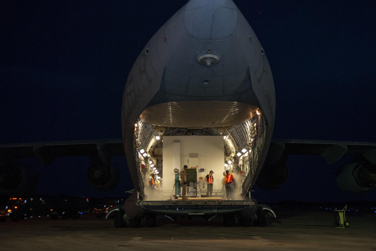 CAPE CANAVERAL, Fla. – Technicians at NASA's Kennedy Space Center in Florida prepare to offload the MAVEN spacecraft from a C-17 aircraft. The aircraft is delivering MAVEN for processing ahead of a launch later this year on a United Launch Alliance Atlas V rocket.    MAVEN, short for Mars Atmosphere and Volatile Evolution, will orbit Mars to study the Red Planet's upper atmosphere in unprecedented detail. Photo credit: NASA/Tim Jacobs