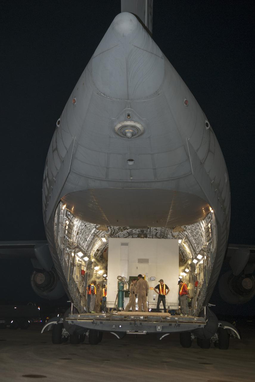 CAPE CANAVERAL, Fla. – Technicians at NASA's Kennedy Space Center in Florida prepare to offload the MAVEN spacecraft from a C-17 aircraft. The aircraft is delivering MAVEN for processing ahead of a launch later this year on a United Launch Alliance Atlas V rocket. MAVEN, short for Mars Atmosphere and Volatile Evolution, will orbit Mars to study the Red Planet's upper atmosphere in unprecedented detail. Photo credit: NASA/Tim Jacobs