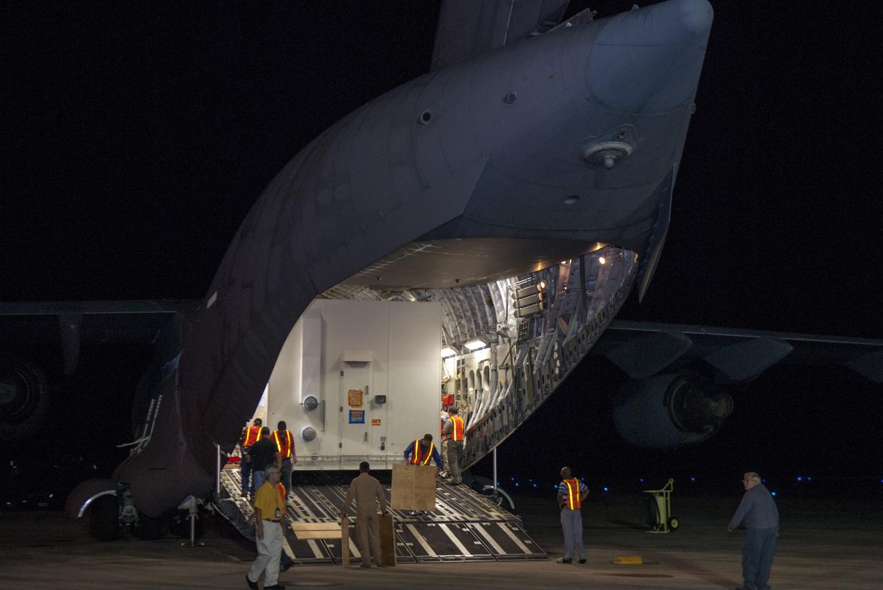 CAPE CANAVERAL, Fla. – Still in its shipping container, the MAVEN spacecraft begins to emerge from a C-17 aircraft following its arrival at NASA's Kennedy Space Center in Florida. The aircraft is delivering MAVEN for processing ahead of a launch later this year on a United Launch Alliance Atlas V rocket. MAVEN, short for Mars Atmosphere and Volatile Evolution, will orbit Mars to study the Red Planet's upper atmosphere in unprecedented detail. Photo credit: NASA/Tim Jacobs