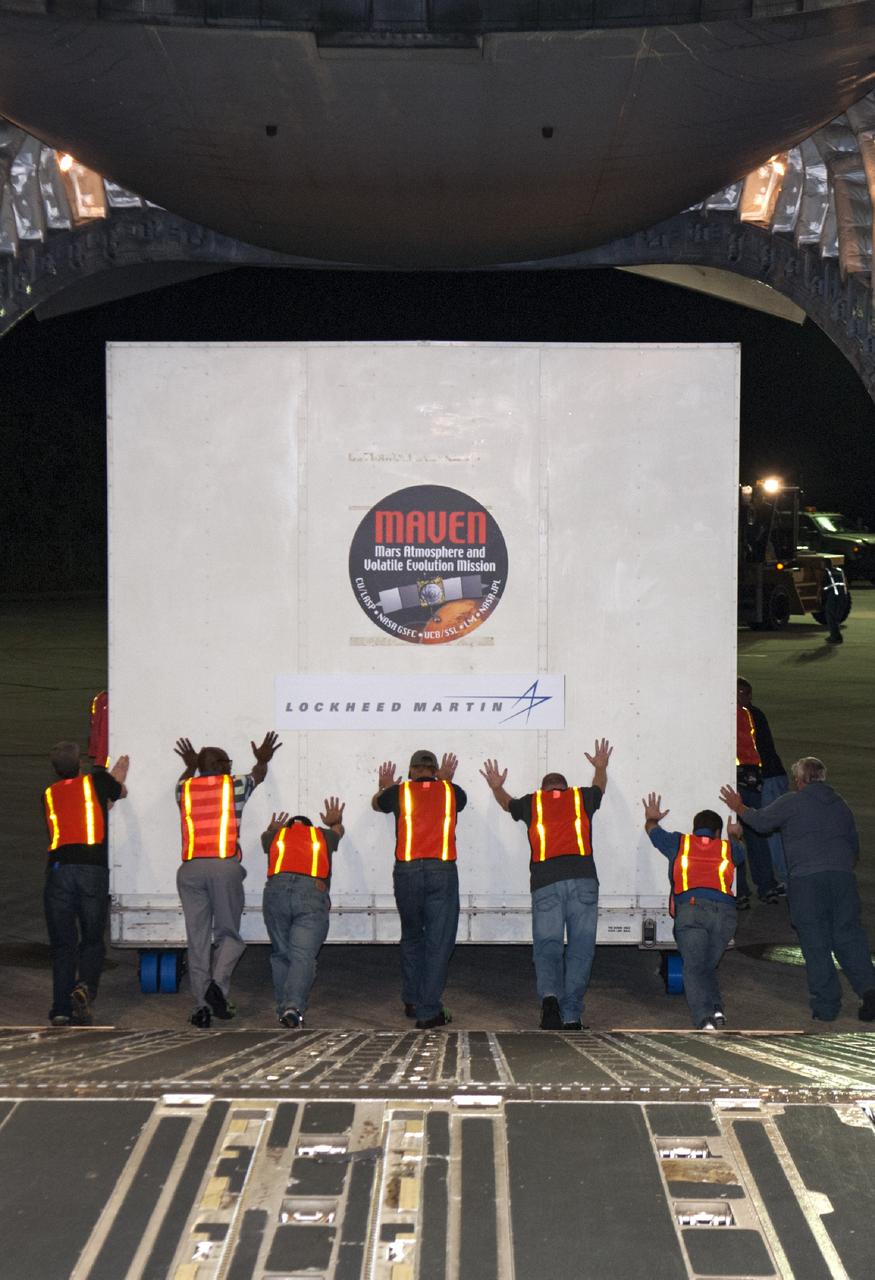 CAPE CANAVERAL, Fla. – Technicians guide the MAVEN spacecraft as it is offloaded from a C-17 aircraft at NASA's Kennedy Space Center in Florida. The aircraft delivered MAVEN for processing ahead of a launch later this year on a United Launch Alliance Atlas V rocket. MAVEN, short for Mars Atmosphere and Volatile Evolution, will orbit Mars to study the Red Planet's upper atmosphere in unprecedented detail. Photo credit: NASA/Tim Jacobs
