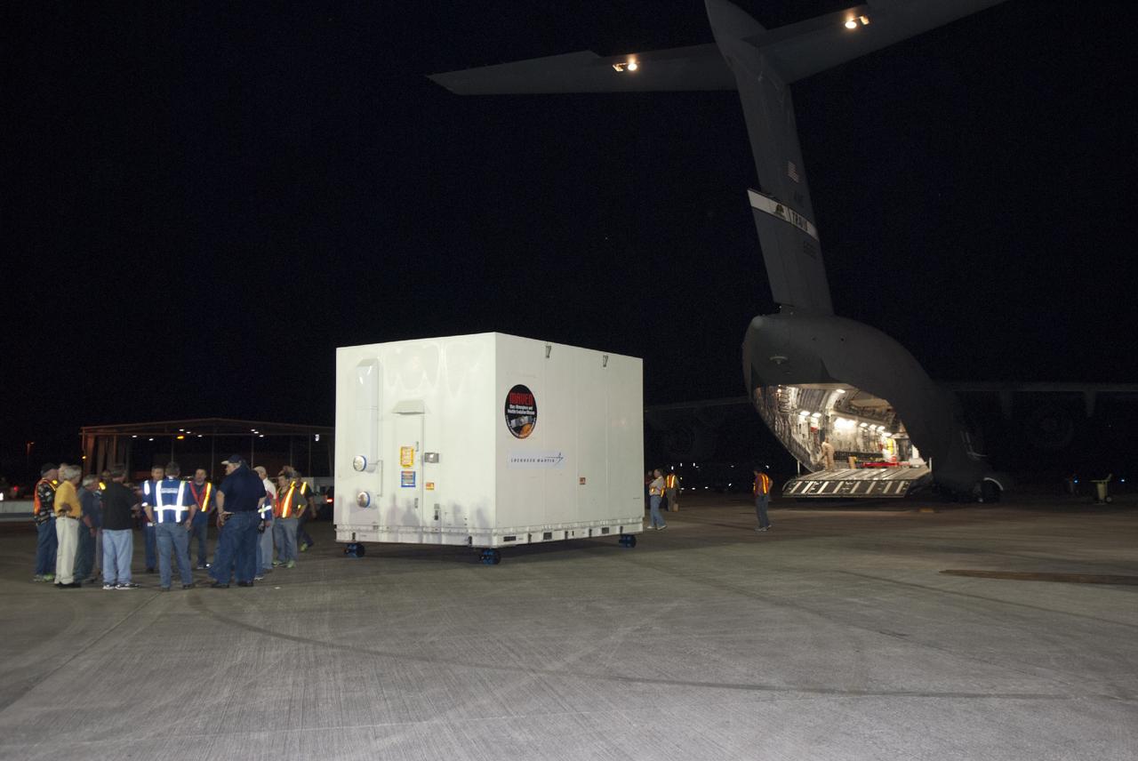 CAPE CANAVERAL, Fla. – At NASA's Kennedy Space Center in Florida, the MAVEN spacecraft, still in its shipping container, rests on the parking apron at the Shuttle Landing Facility following offload from a C-17 aircraft. The aircraft delivered MAVEN for processing ahead of a launch later this year on a United Launch Alliance Atlas V rocket. MAVEN, short for Mars Atmosphere and Volatile Evolution, will orbit Mars to study the Red Planet's upper atmosphere in unprecedented detail. Photo credit: NASA/Tim Jacobs