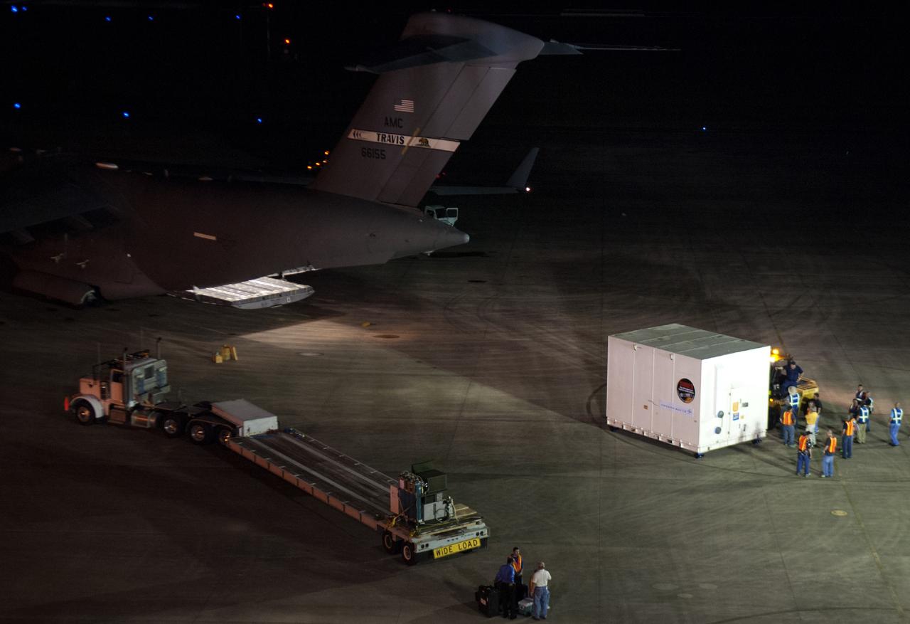 CAPE CANAVERAL, Fla. – At NASA's Kennedy Space Center in Florida, the MAVEN spacecraft, still in its shipping container, is prepared for transport following offload from a C-17 aircraft. The aircraft delivered MAVEN for processing ahead of a launch later this year on a United Launch Alliance Atlas V rocket. MAVEN, short for Mars Atmosphere and Volatile Evolution, will orbit Mars to study the Red Planet's upper atmosphere in unprecedented detail. Photo credit: NASA/Tim Jacobs