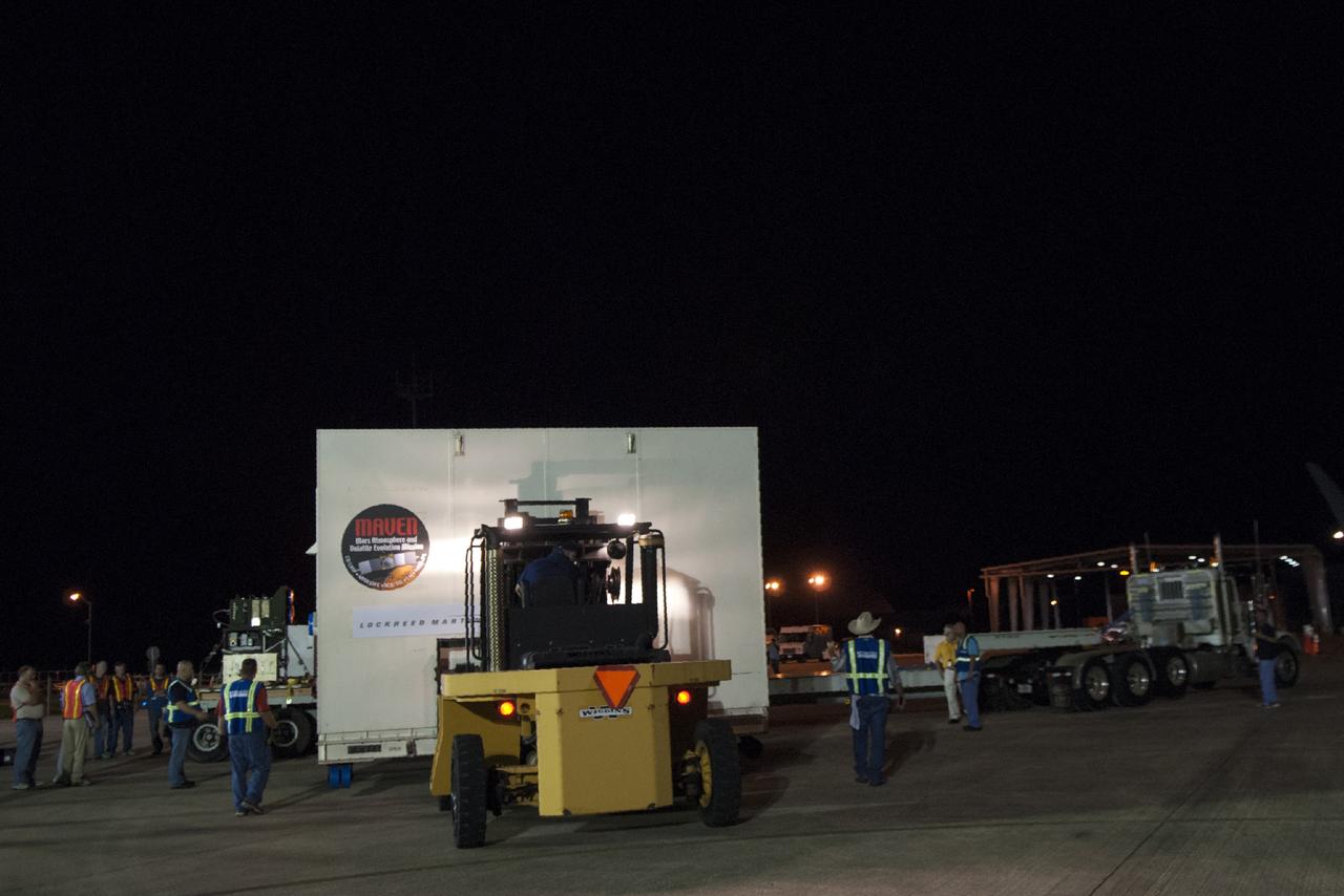 CAPE CANAVERAL, Fla. – At NASA's Kennedy Space Center in Florida, the MAVEN spacecraft, still in its shipping container, is prepared for transport following offload from a C-17 aircraft. The aircraft delivered MAVEN for processing ahead of a launch later this year on a United Launch Alliance Atlas V rocket. MAVEN, short for Mars Atmosphere and Volatile Evolution, will orbit Mars to study the Red Planet's upper atmosphere in unprecedented detail. Photo credit: NASA/Tim Jacobs
