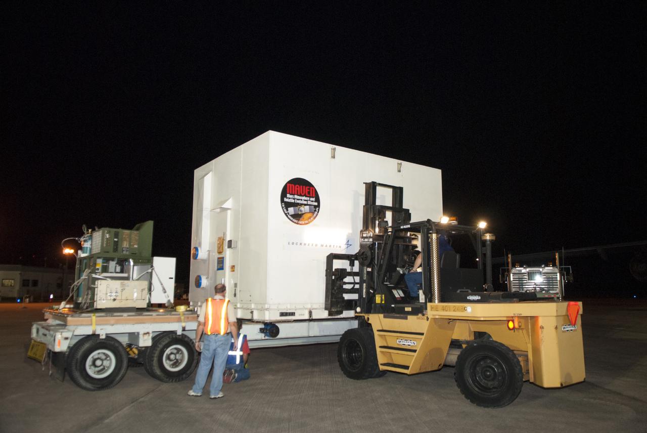 CAPE CANAVERAL, Fla. – At NASA's Kennedy Space Center in Florida, the MAVEN spacecraft, still in its shipping container, is lifted onto a truck following offload from a C-17 aircraft. The aircraft delivered MAVEN for processing ahead of a launch later this year on a United Launch Alliance Atlas V rocket. MAVEN, short for Mars Atmosphere and Volatile Evolution, will orbit Mars to study the Red Planet's upper atmosphere in unprecedented detail. Photo credit: NASA/Tim Jacobs