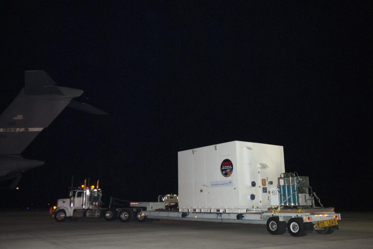 CAPE CANAVERAL, Fla. – At NASA's Kennedy Space Center in Florida, the MAVEN spacecraft, still in its shipping container, is placed aboard a truck. A C-17 aircraft delivered MAVEN for processing ahead of a launch later this year on a United Launch Alliance Atlas V rocket. MAVEN, short for Mars Atmosphere and Volatile Evolution, will orbit Mars to study the Red Planet's upper atmosphere in unprecedented detail. Photo credit: NASA/Tim Jacobs