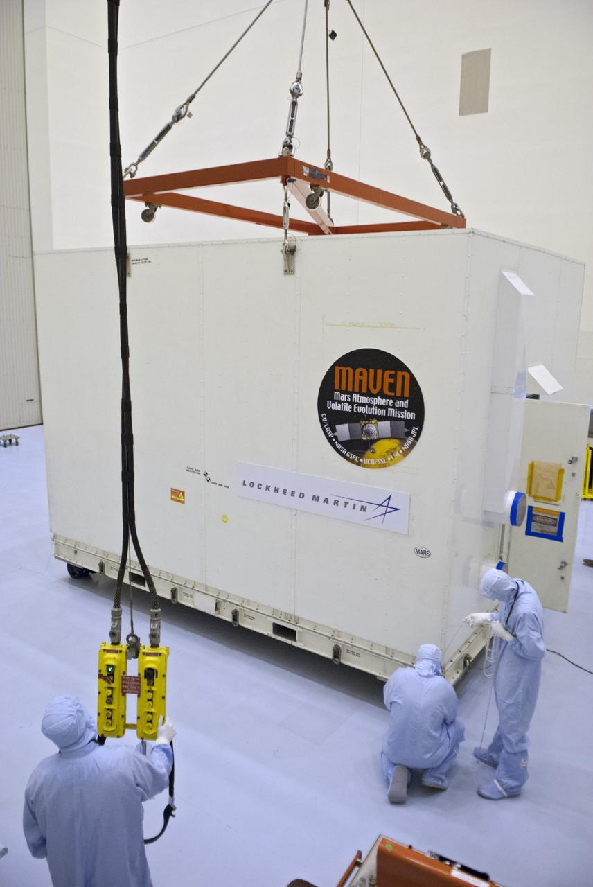 CAPE CANAVERAL, Fla. – Engineers prepare to remove a shipping container from around NASA’s Mars Atmosphere and Volatile Evolution MAVEN spacecraft inside the Payload Hazardous Servicing Facility on Aug. 3, 2013, at the agency’s Kennedy Space Center in Florida. MAVEN will be prepared inside the facility for its scheduled November launch to Mars. Positioned in an orbit above the Red Planet, MAVEN will study the upper atmosphere of Mars in unprecedented detail. Photo credit: NASA/Tim Jacobs