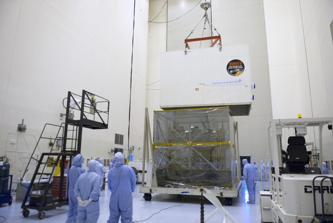 CAPE CANAVERAL, Fla. – Engineers use a sling to remove a shipping container from around NASA’s Mars Atmosphere and Volatile Evolution MAVEN spacecraft inside the Payload Hazardous Servicing Facility on Aug. 3, 2013, at the agency’s Kennedy Space Center in Florida. MAVEN will be prepared inside the facility for its scheduled November launch to Mars. Positioned in an orbit above the Red Planet, MAVEN will study the upper atmosphere of Mars in unprecedented detail. Photo credit: NASA/Tim Jacobs