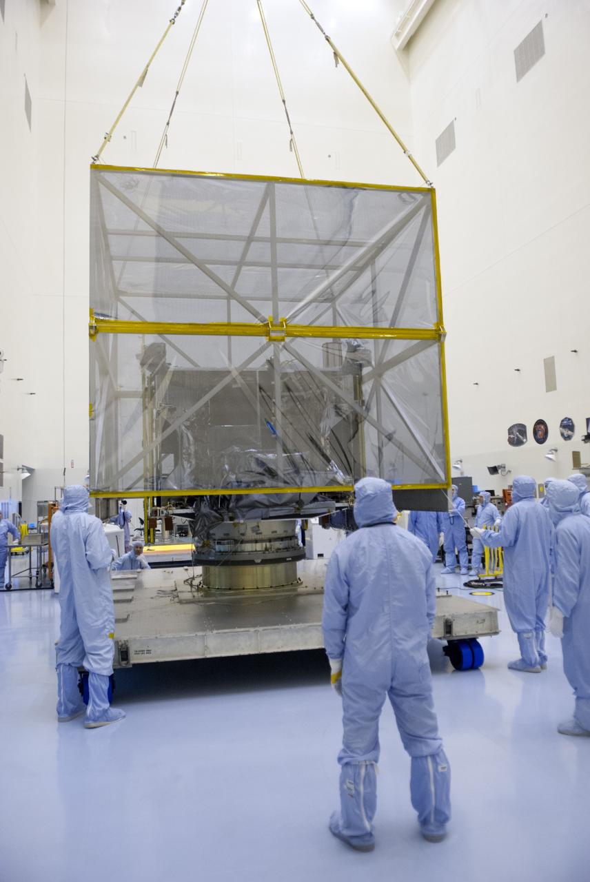 CAPE CANAVERAL, Fla. – A crane lifts shipping material from around NASA’s Mars Atmosphere and Volatile Evolution MAVEN spacecraft inside the Payload Hazardous Servicing Facility on Aug. 3, 2013, at the agency’s Kennedy Space Center in Florida. MAVEN will be prepared inside the facility for its scheduled November launch to Mars. Positioned in an orbit above the Red Planet, MAVEN will study the upper atmosphere of Mars in unprecedented detail. Photo credit: NASA/Tim Jacobs