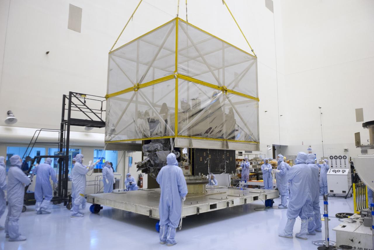 CAPE CANAVERAL, Fla. – A crane lifts shipping material from around NASA’s Mars Atmosphere and Volatile Evolution MAVEN spacecraft inside the Payload Hazardous Servicing Facility on Aug. 3, 2013, at the agency’s Kennedy Space Center in Florida. MAVEN will be prepared inside the facility for its scheduled November launch to Mars. Positioned in an orbit above the Red Planet, MAVEN will study the upper atmosphere of Mars in unprecedented detail. Photo credit: NASA/Tim Jacobs