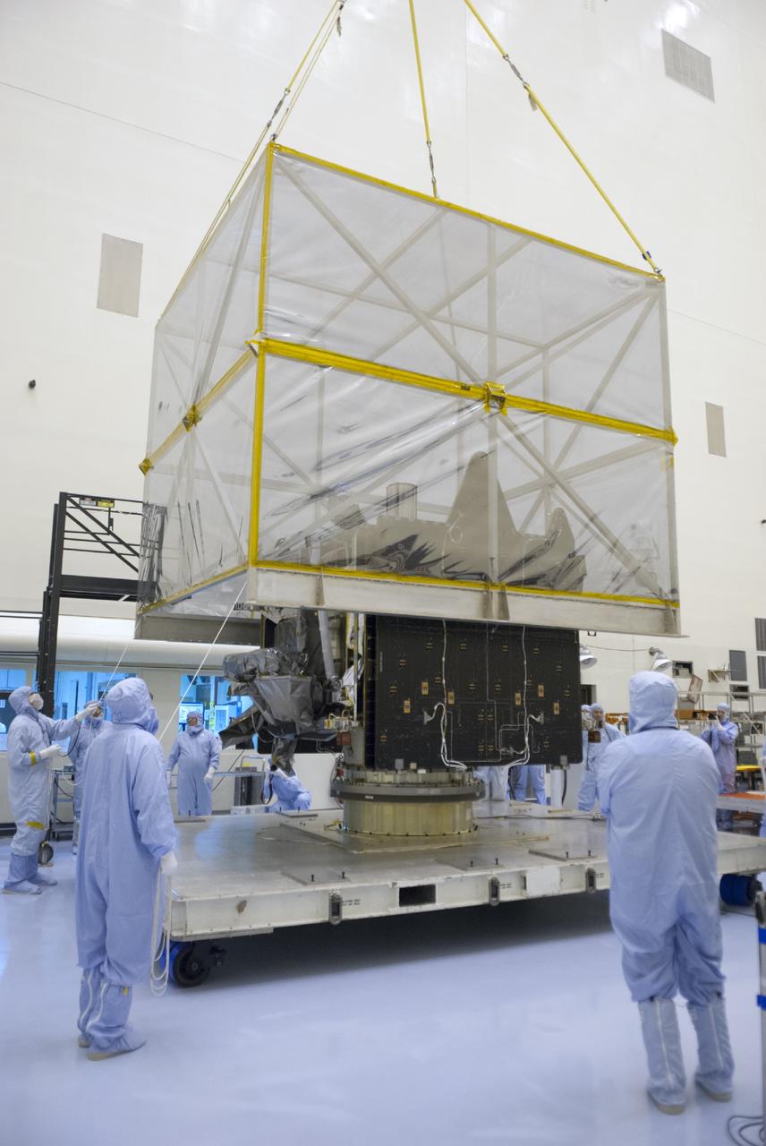 CAPE CANAVERAL, Fla. – A crane lifts shipping material from around NASA’s Mars Atmosphere and Volatile Evolution MAVEN spacecraft inside the Payload Hazardous Servicing Facility on Aug. 3, 2013, at the agency’s Kennedy Space Center in Florida. MAVEN will be prepared inside the facility for its scheduled November launch to Mars. Positioned in an orbit above the Red Planet, MAVEN will study the upper atmosphere of Mars in unprecedented detail. Photo credit: NASA/Tim Jacobs