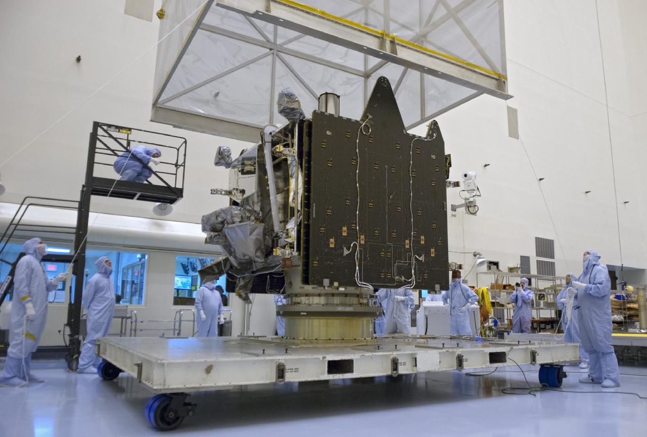 CAPE CANAVERAL, Fla. – A crane lifts shipping material from around NASA’s Mars Atmosphere and Volatile Evolution MAVEN spacecraft inside the Payload Hazardous Servicing Facility on Aug. 3, 2013, at the agency’s Kennedy Space Center in Florida. MAVEN will be prepared inside the facility for its scheduled November launch to Mars. Positioned in an orbit above the Red Planet, MAVEN will study the upper atmosphere of Mars in unprecedented detail. Photo credit: NASA/Tim Jacobs