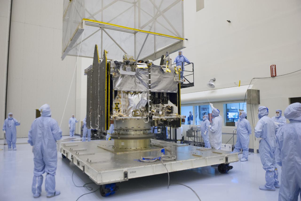 CAPE CANAVERAL, Fla. – Engineers oversee the removal of shipping material from around NASA’s Mars Atmosphere and Volatile Evolution MAVEN spacecraft inside the Payload Hazardous Servicing Facility on Aug. 3, 2013, at the agency’s Kennedy Space Center in Florida. MAVEN will be prepared inside the facility for its scheduled November launch to Mars. Positioned in an orbit above the Red Planet, MAVEN will study the upper atmosphere of Mars in unprecedented detail. Photo credit: NASA/Tim Jacobs