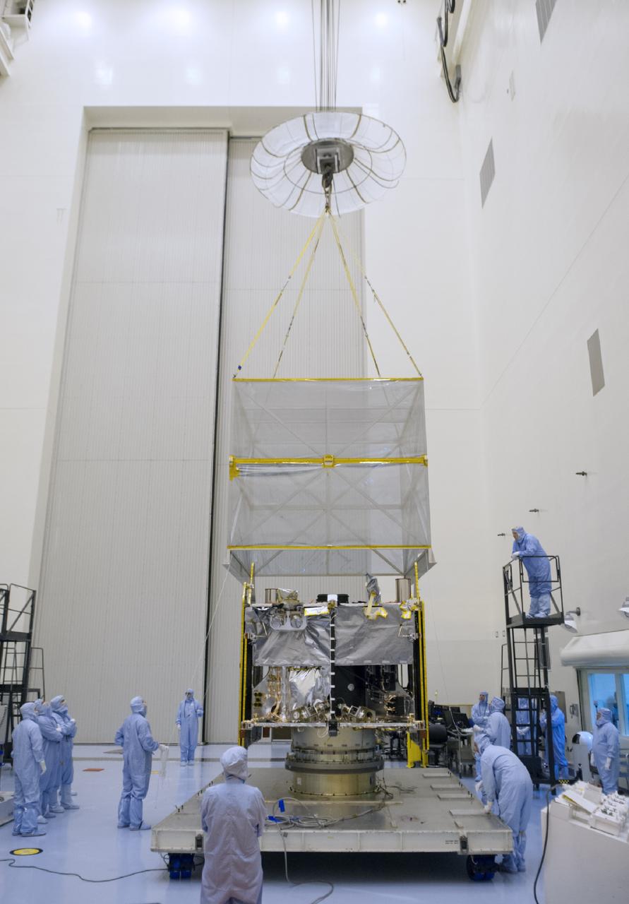 CAPE CANAVERAL, Fla. – A crane lifts shipping material from around NASA’s Mars Atmosphere and Volatile Evolution MAVEN spacecraft inside the Payload Hazardous Servicing Facility on Aug. 3, 2013, at the agency’s Kennedy Space Center in Florida. MAVEN will be prepared inside the facility for its scheduled November launch to Mars. Positioned in an orbit above the Red Planet, MAVEN will study the upper atmosphere of Mars in unprecedented detail. Photo credit: NASA/Tim Jacobs