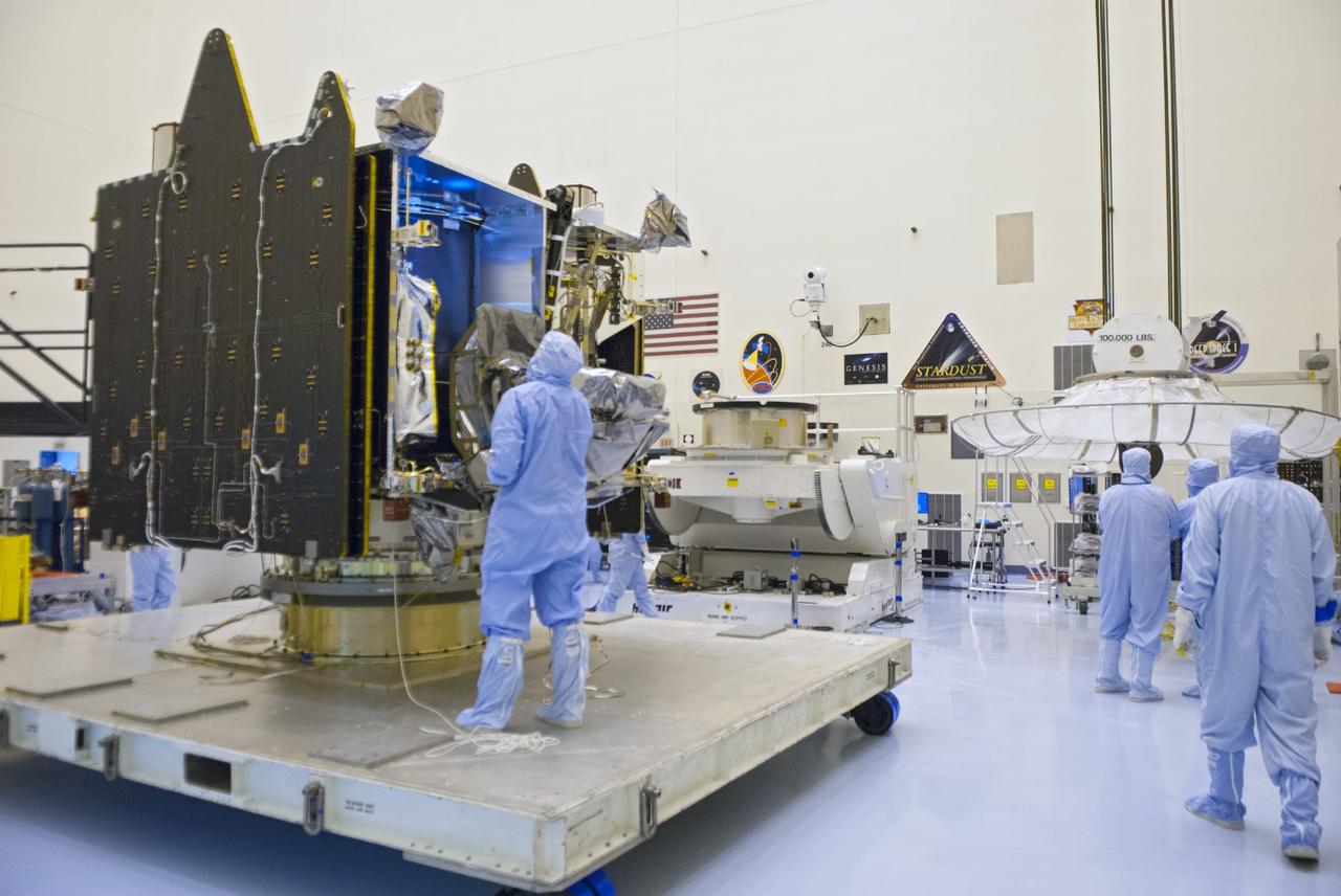 CAPE CANAVERAL, Fla. – Engineers examine NASA’s Mars Atmosphere and Volatile Evolution MAVEN spacecraft inside the Payload Hazardous Servicing Facility on Aug. 3, 2013, at the agency’s Kennedy Space Center in Florida. MAVEN will be prepared inside the facility for its scheduled November launch to Mars. Positioned in an orbit above the Red Planet, MAVEN will study the upper atmosphere of Mars in unprecedented detail. Photo credit: NASA/Tim Jacobs