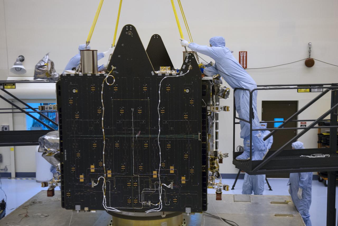 CAPE CANAVERAL, Fla. – An engineer positions a sling on NASA’s Mars Atmosphere and Volatile Evolution MAVEN spacecraft inside the Payload Hazardous Servicing Facility on Aug. 3, 2013, at the agency’s Kennedy Space Center in Florida. MAVEN will be prepared inside the facility for its scheduled November launch to Mars. Positioned in an orbit above the Red Planet, MAVEN will study the upper atmosphere of Mars in unprecedented detail. Photo credit: NASA/Tim Jacobs