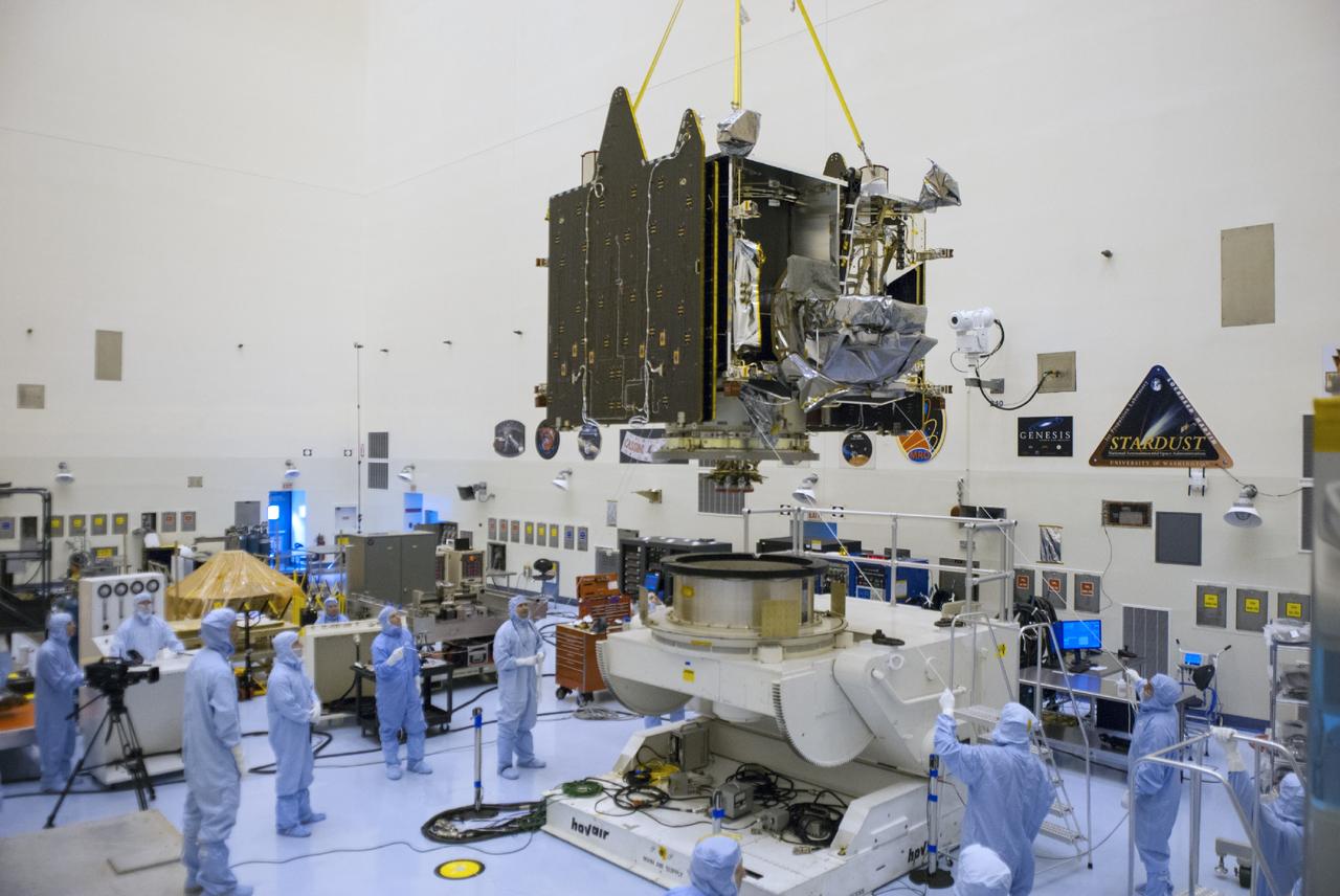 CAPE CANAVERAL, Fla. – A crane lifts NASA’s Mars Atmosphere and Volatile Evolution MAVEN spacecraft onto a processing stand inside the Payload Hazardous Servicing Facility on Aug. 3, 2013, at the agency’s Kennedy Space Center in Florida. MAVEN will be prepared inside the facility for its scheduled November launch to Mars. Positioned in an orbit above the Red Planet, MAVEN will study the upper atmosphere of Mars in unprecedented detail. Photo credit: NASA/Tim Jacobs