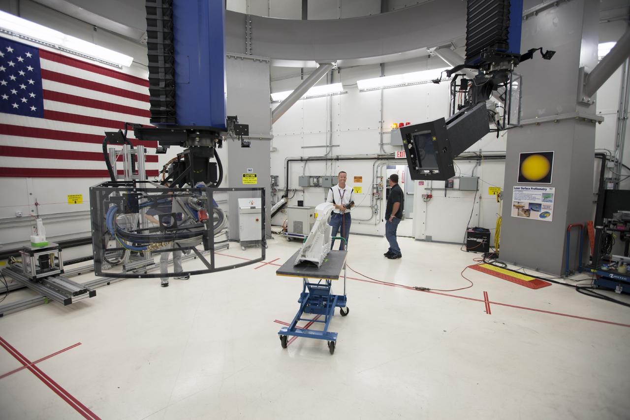 CAPE CANAVERAL, Fla. – In Hangar N at Cape Canaveral Air Force Station, PaR Systems, Inc. operations engineer Jeff Elston, left, and Tony Corak, manager of NDT Services for PaR Systems, operate an 11-axis robotic X-ray system which takes images of hardware for evaluation. The activity is part of work performed by PaR Systems, Inc. under a partnership agreement with NASA.      NASA's Kennedy Space Center in Florida recently established a partnership agreement with PaR Systems, Inc. of Shoreview, Minn., for operation of the Hangar N facility and its nondestructive testing and evaluation equipment. As the spaceport transitions from a historically government-only launch facility to a multi-user spaceport for both federal and commercial customers, partnerships between the space agency and other organizations will be a key element in that effort. Hangar N is located at Cape Canaveral Air Force Station adjacent to Kennedy and houses a unique inventory of test and evaluation equipment and the capability for current and future mission spaceflight support. Photo credit: NASA/ Dimitri Gerondidakis
