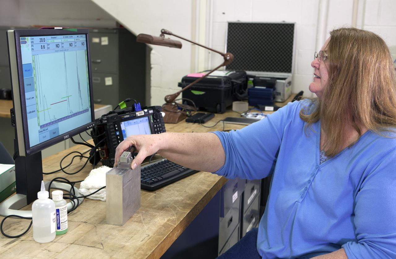 CAPE CANAVERAL, Fla. – In Hangar N at Cape Canaveral Air Force Station, PaR Systems, Inc. operations engineer Lu Bell conducts a phase array ultrasonic inspection.      NASA's Kennedy Space Center in Florida recently established a partnership agreement with PaR Systems, Inc. of Shoreview, Minn., for operation of the Hangar N facility and its nondestructive testing and evaluation equipment. As the spaceport transitions from a historically government-only launch facility to a multi-user spaceport for both federal and commercial customers, partnerships between the space agency and other organizations will be a key element in that effort. Hangar N is located at Cape Canaveral Air Force Station adjacent to Kennedy and houses a unique inventory of test and evaluation equipment and the capability for current and future mission spaceflight support. Photo credit: NASA/ Dimitri Gerondidakis