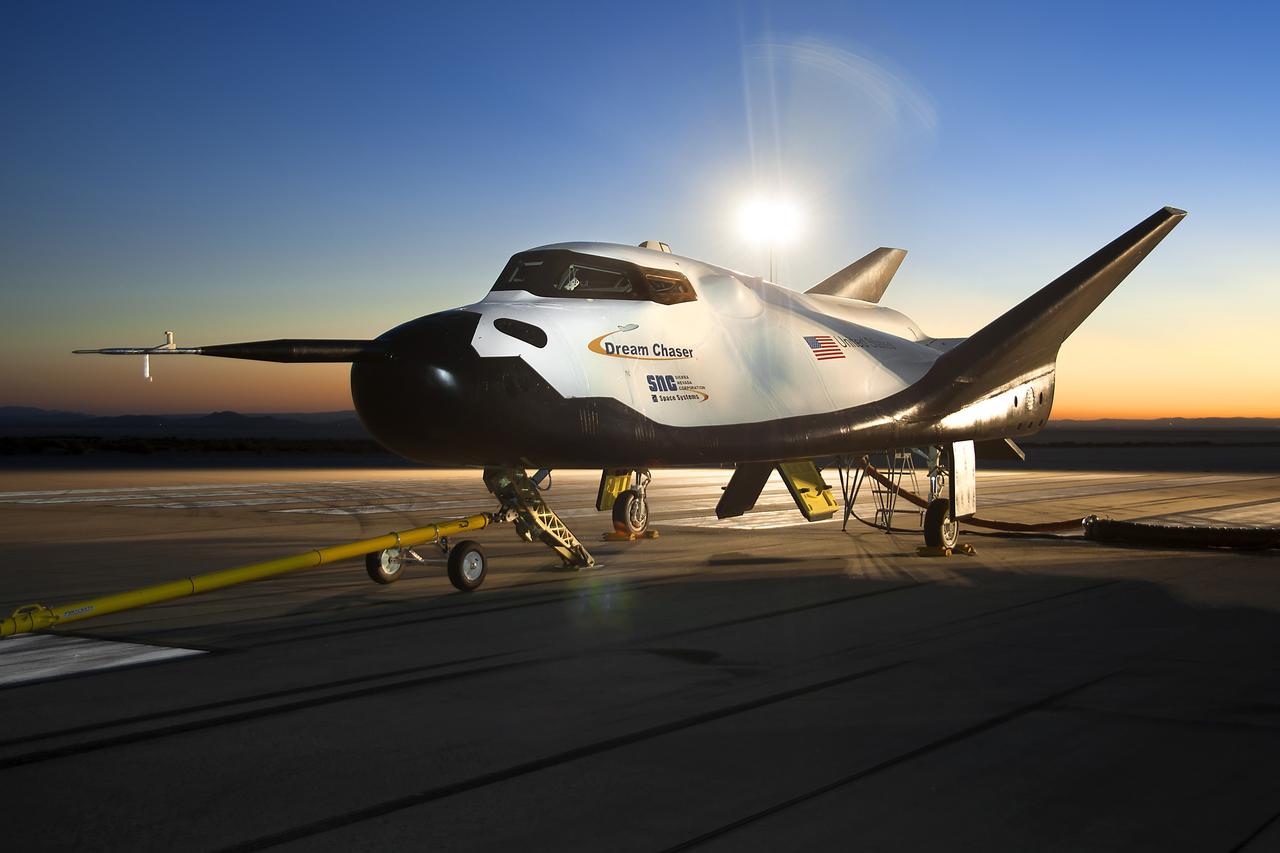 Edwards, Calif. – ED13-0266-023- The Sierra Nevada Corporation, or SNC, Dream Chaser flight vehicle is prepared for 60 mile per hour tow tests on taxi and runways at NASA's Dryden Flight Research Center at Edwards Air Force Base in California. Ground testing at 10, 20, 40 and 60 miles per hour is helping the company validate the performance of the spacecraft's braking and landing systems prior to captive-carry and free-flight tests scheduled for later this year.          SNC is continuing the development of its Dream Chaser spacecraft under the agency's Commercial Crew Development Round 2, or CCDev2, and Commercial Crew Integrated Capability, or CCiCap, phases, which are intended to lead to the availability of commercial human spaceflight services for government and commercial customers. To learn more about CCP and its industry partners, visit www.nasa.gov/commercialcrew. Image credit: NASA/Ken Ulbrich