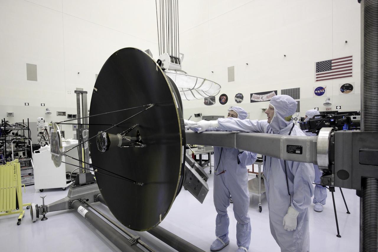 CAPE CANAVERAL, Fla. – Inside the Payload Hazardous Servicing Facility at NASA's Kennedy Space Center in Florida, technicians prepare to install the parabolic high gain antenna onto the Mars Atmosphere and Volatile Evolution, or MAVEN spacecraft.      The antenna will communicate vast amounts of data to Earth during the mission. MAVEN is being prepared inside the facility for its scheduled November launch aboard a United Launch Alliance Atlas V rocket to Mars. Positioned in an orbit above the Red Planet, MAVEN will study the upper atmosphere of Mars in unprecedented detail. Photo credit: NASA/Jim Grossmann