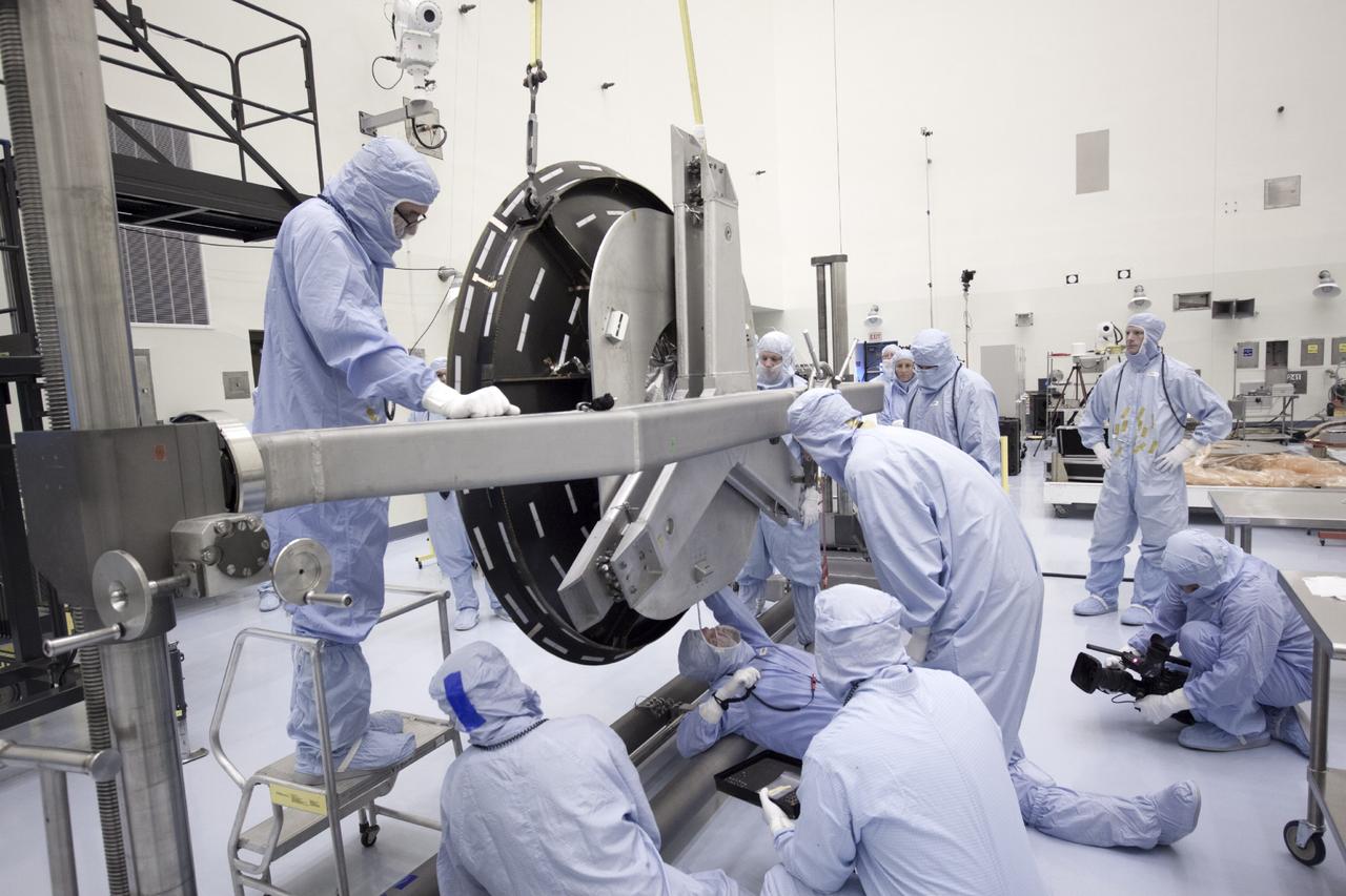 CAPE CANAVERAL, Fla. – Inside the Payload Hazardous Servicing Facility at NASA's Kennedy Space Center in Florida, technicians prepare to install the parabolic high gain antenna onto the Mars Atmosphere and Volatile Evolution, or MAVEN spacecraft.      The antenna will communicate vast amounts of data to Earth during the mission. MAVEN is being prepared inside the facility for its scheduled November launch aboard a United Launch Alliance Atlas V rocket to Mars. Positioned in an orbit above the Red Planet, MAVEN will study the upper atmosphere of Mars in unprecedented detail. Photo credit: NASA/Jim Grossmann