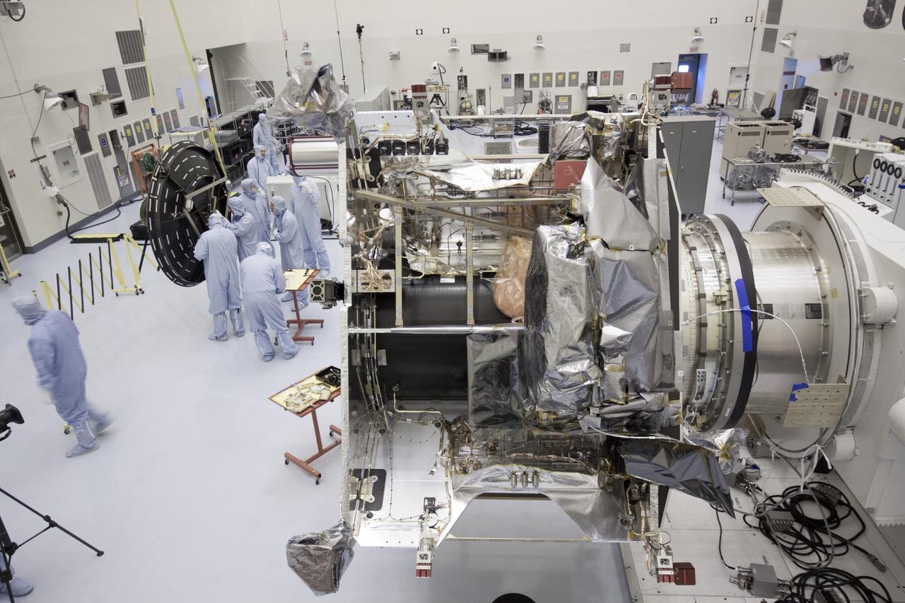 CAPE CANAVERAL, Fla. – Inside the Payload Hazardous Servicing Facility at NASA's Kennedy Space Center in Florida, preparations are under way to install the parabolic high gain antenna, left, onto the Mars Atmosphere and Volatile Evolution, or MAVEN spacecraft.      The antenna will communicate vast amounts of data to Earth during the mission. MAVEN is being prepared inside the facility for its scheduled November launch aboard a United Launch Alliance Atlas V rocket to Mars. Positioned in an orbit above the Red Planet, MAVEN will study the upper atmosphere of Mars in unprecedented detail. Photo credit: NASA/Jim Grossmann