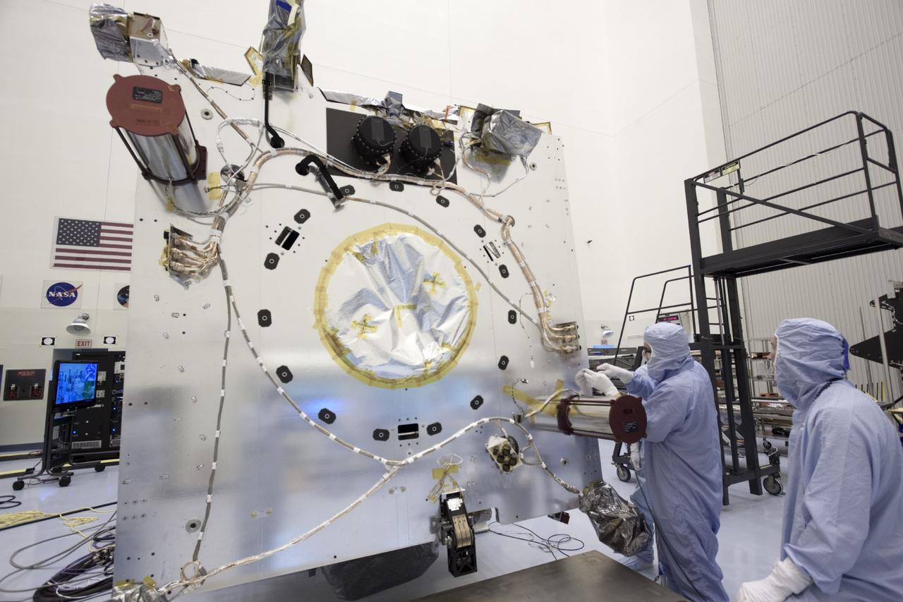 CAPE CANAVERAL, Fla. – Inside the Payload Hazardous Servicing Facility at NASA's Kennedy Space Center in Florida, technicians prepare the Mars Atmosphere and Volatile Evolution, or MAVEN spacecraft, to receive its parabolic high gain antenna.      The antenna will communicate vast amounts of data to Earth during the mission. MAVEN is being prepared inside the facility for its scheduled November launch aboard a United Launch Alliance Atlas V rocket to Mars. Positioned in an orbit above the Red Planet, MAVEN will study the upper atmosphere of Mars in unprecedented detail. Photo credit: NASA/Jim Grossmann