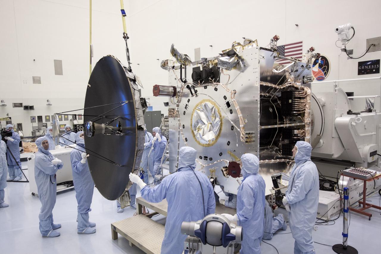 CAPE CANAVERAL, Fla. – At NASA’s Kennedy Space Center in Florida, technicians install the parabolic high gain antenna onto the Mars Atmosphere and Volatile Evolution, or MAVEN spacecraft, in the Payload Hazardous Servicing Facility. The antenna will communicate vast amounts of data to Earth during the mission.    MAVEN is being prepared inside the facility for its scheduled November launch aboard a United Launch Alliance Atlas V rocket to Mars. Positioned in an orbit above the Red Planet, MAVEN will study the upper atmosphere of Mars in unprecedented detail. Photo credit: NASA/Jim Grossmann