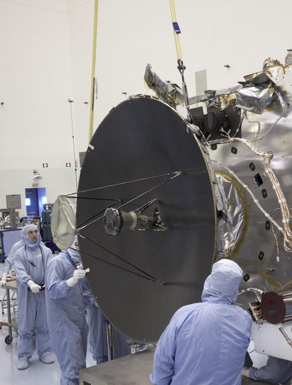 CAPE CANAVERAL, Fla. – At NASA’s Kennedy Space Center in Florida, technicians install the parabolic high gain antenna onto the Mars Atmosphere and Volatile Evolution, or MAVEN spacecraft, in the Payload Hazardous Servicing Facility. The antenna will communicate vast amounts of data to Earth during the mission.    MAVEN is being prepared inside the facility for its scheduled November launch aboard a United Launch Alliance Atlas V rocket to Mars. Positioned in an orbit above the Red Planet, MAVEN will study the upper atmosphere of Mars in unprecedented detail. Photo credit: NASA/Jim Grossmann
