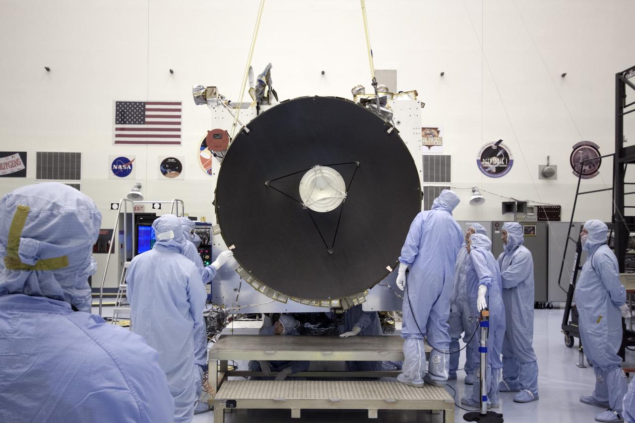 CAPE CANAVERAL, Fla. – At NASA's Kennedy Space Center in Florida, technicians position the parabolic high gain antenna for installation on the Mars Atmosphere and Volatile Evolution, or MAVEN spacecraft, in the Payload Hazardous Servicing Facility.      The antenna will communicate vast amounts of data to Earth during the mission. MAVEN is being prepared inside the facility for its scheduled November launch aboard a United Launch Alliance Atlas V rocket to Mars. Positioned in an orbit above the Red Planet, MAVEN will study the upper atmosphere of Mars in unprecedented detail. Photo credit: NASA/Jim Grossmann