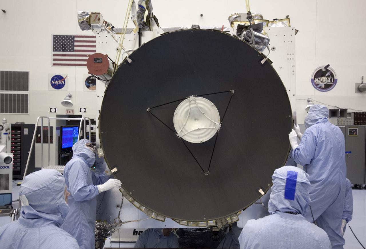 CAPE CANAVERAL, Fla. – Inside the Payload Hazardous Servicing Facility at NASA's Kennedy Space Center in Florida, the parabolic high gain antenna is installed on the Mars Atmosphere and Volatile Evolution, or MAVEN spacecraft.      The antenna will communicate vast amounts of data to Earth during the mission. MAVEN is being prepared inside the facility for its scheduled November launch aboard a United Launch Alliance Atlas V rocket to Mars. Positioned in an orbit above the Red Planet, MAVEN will study the upper atmosphere of Mars in unprecedented detail. Photo credit: NASA/Jim Grossmann