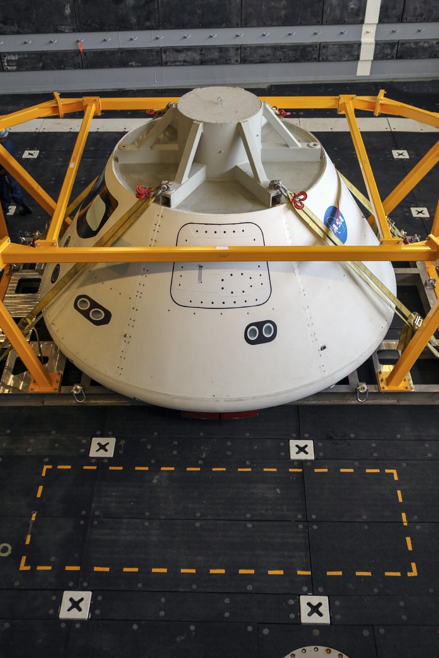 HAMPTON, Va. – At the Naval Station Norfolk near NASA’s Langley Research Center in Virginia, the Orion boilerplate test article has been secured on a U.S. Navy ship after arriving by floating dock system for a stationary recovery test. NASA and the U.S. Navy are conducting tests to prepare for recovery of the Orion crew module and forward bay cover on its return from a deep space mission. The stationary recovery test will allow the teams to demonstrate and evaluate the recovery processes, procedures, hardware and personnel in a controlled environment before conducting a second recovery test next year in open waters. Orion is the exploration spacecraft designed to carry astronauts to destinations not yet explored by humans, including an asteroid and Mars. It will have emergency abort capability, sustain the crew during space travel and provide safe re-entry from deep space return velocities. The first unpiloted test flight of the Orion is scheduled to launch in 2014 atop a Delta IV rocket and in 2017 on NASA’s Space Launch System rocket. For more information, visit http://www.nasa.gov/orion. Photo credit: NASA/Dimitri Gerondidakis