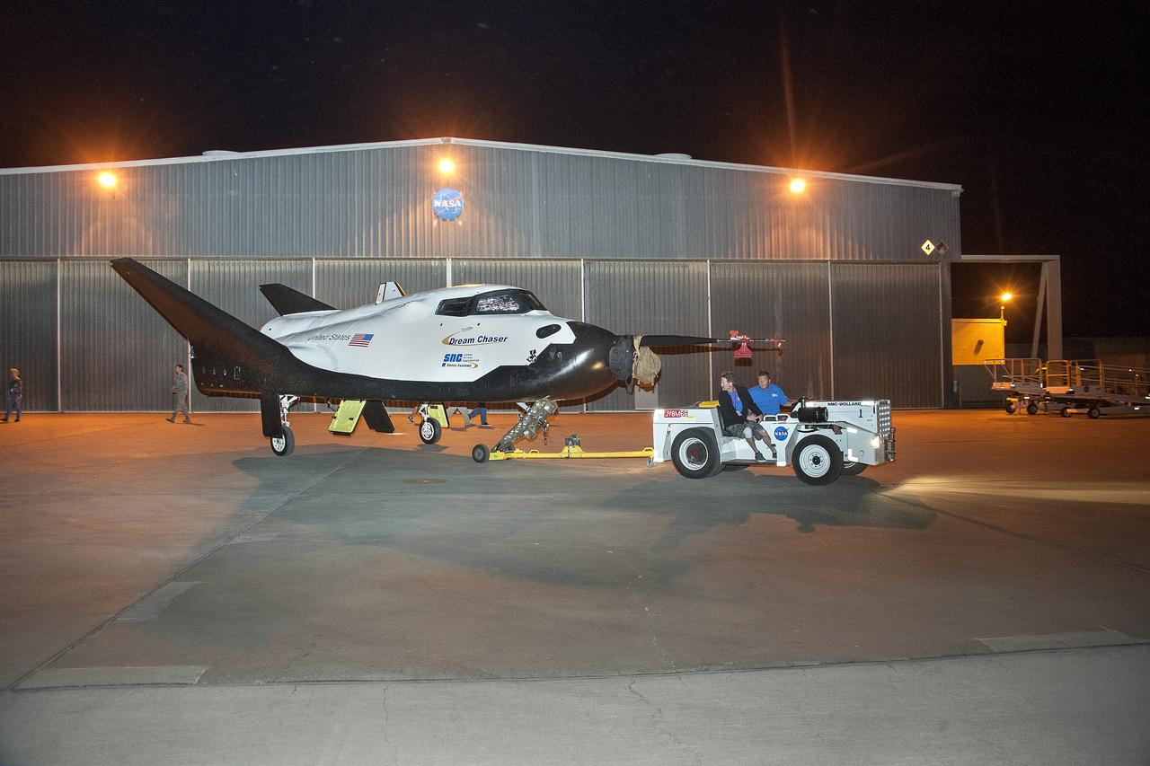 Edwards, Calif. – ED13-0266-008- The Sierra Nevada Corporation, or SNC, Dream Chaser flight vehicle is prepared for 60 mph tow tests on taxi and runways at NASA's Dryden Flight Research Center at Edwards Air Force Base in California. Ground testing at 10, 20, 40 and 60 miles per hour is helping the company validate the performance of the spacecraft's braking and landing systems prior to captive-carry and free-flight tests scheduled for later this year.            SNC is continuing the development of its Dream Chaser spacecraft under the agency's Commercial Crew Development Round 2, or CCDev2, and Commercial Crew Integrated Capability, or CCiCap, phases, which are intended to lead to the availability of commercial human spaceflight services for government and commercial customers. To learn more about CCP and its industry partners, visit www.nasa.gov/commercialcrew. Image credit: NASA/Ken Ulbrich