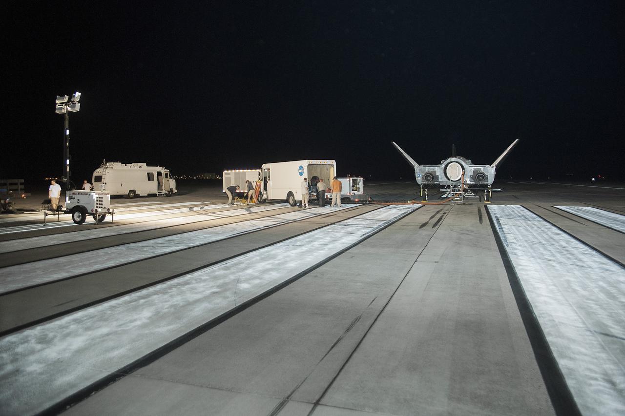 Edwards, Calif. – ED13-0266-010- The Sierra Nevada Corporation, or SNC, Dream Chaser flight vehicle is prepared for 60 mph tow tests on taxi and runways at NASA's Dryden Flight Research Center at Edwards Air Force Base in California. Ground testing at 10, 20, 40 and 60 miles per hour is helping the company validate the performance of the spacecraft's braking and landing systems prior to captive-carry and free-flight tests scheduled for later this year.              SNC is continuing the development of its Dream Chaser spacecraft under the agency's Commercial Crew Development Round 2, or CCDev2, and Commercial Crew Integrated Capability, or CCiCap, phases, which are intended to lead to the availability of commercial human spaceflight services for government and commercial customers. To learn more about CCP and its industry partners, visit www.nasa.gov/commercialcrew. Image credit: NASA/Ken Ulbrich