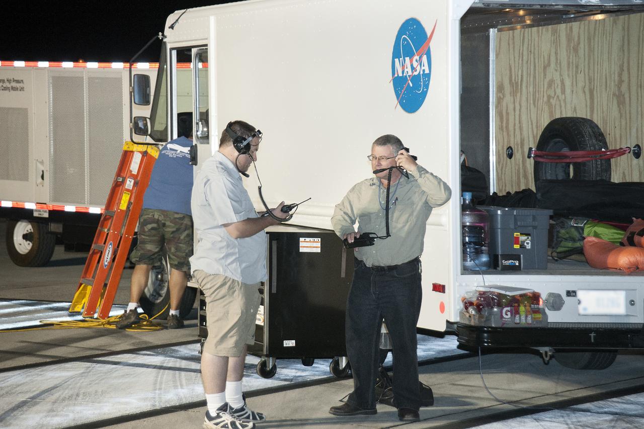 Edwards, Calif. – ED13-0266-012- Technicians prepare for 60 mph tow tests of Sierra Nevada Corporation's, or SNC's, Dream Chaser flight vehicle on taxi and runways at NASA's Dryden Flight Research Center at Edwards Air Force Base in California. Ground testing at 10, 20, 40 and 60 miles per hour is helping the company validate the performance of the spacecraft's braking and landing systems prior to captive-carry and free-flight tests scheduled for later this year.                SNC is continuing the development of its Dream Chaser spacecraft under the agency's Commercial Crew Development Round 2, or CCDev2, and Commercial Crew Integrated Capability, or CCiCap, phases, which are intended to lead to the availability of commercial human spaceflight services for government and commercial customers. To learn more about CCP and its industry partners, visit www.nasa.gov/commercialcrew. Image credit: NASA/Ken Ulbrich