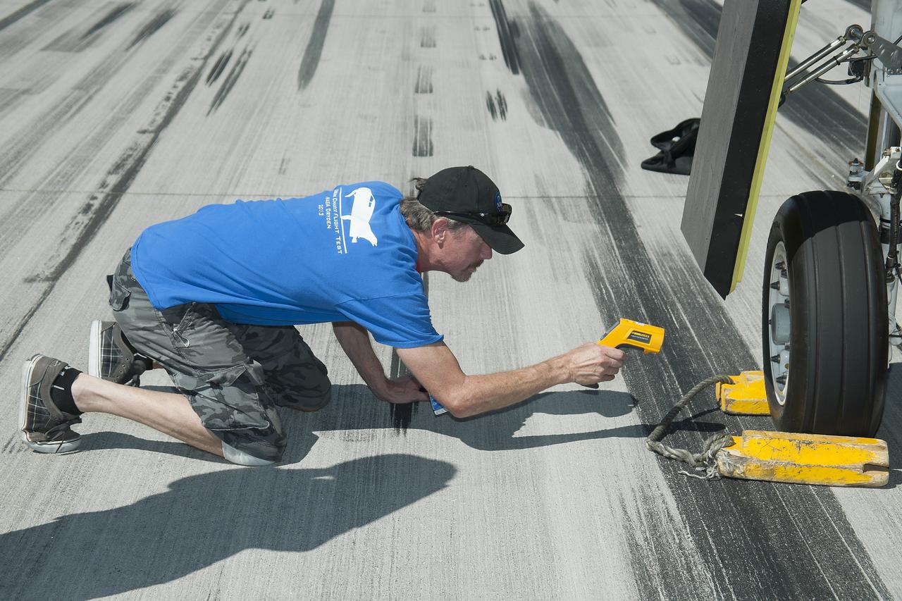Edwards, Calif. – ED13-0266-060- A Sierra Nevada Corporation, or SNC, team member checks the company's Dream Chaser flight vehicle systems following a 60 mph tow test on taxi and runways at NASA's Dryden Flight Research Center at Edwards Air Force Base in California. Ground testing at 10, 20, 40 and 60 miles per hour is helping the company validate the performance of the spacecraft's braking and landing systems prior to captive-carry and free-flight tests scheduled for later this year.                SNC is continuing the development of its Dream Chaser spacecraft under the agency's Commercial Crew Development Round 2, or CCDev2, and Commercial Crew Integrated Capability, or CCiCap, phases, which are intended to lead to the availability of commercial human spaceflight services for government and commercial customers. To learn more about CCP and its industry partners, visit www.nasa.gov/commercialcrew. Image credit: NASA/Ken Ulbrich
