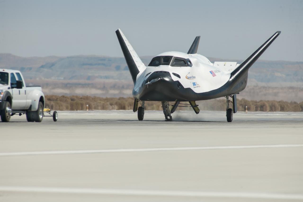 Edwards, Calif. – ED13-0266-066- A pickup truck releases the Sierra Nevada Corporation, or SNC, Dream Chaser flight vehicle during a 60 mile per hour tow test to validate the spacecraft's brakes on taxi and runways at NASA's Dryden Flight Research Center at Edwards Air Force Base in California. Ground testing at 10, 20, 40 and 60 miles per hour is helping the company validate the performance of the spacecraft's braking and landing systems prior to captive-carry and free-flight tests scheduled for later this year.              SNC is continuing the development of its Dream Chaser spacecraft under the agency's Commercial Crew Development Round 2, or CCDev2, and Commercial Crew Integrated Capability, or CCiCap, phases, which are intended to lead to the availability of commercial human spaceflight services for government and commercial customers. To learn more about CCP and its industry partners, visit www.nasa.gov/commercialcrew. Image credit: NASA/Ken Ulbrich