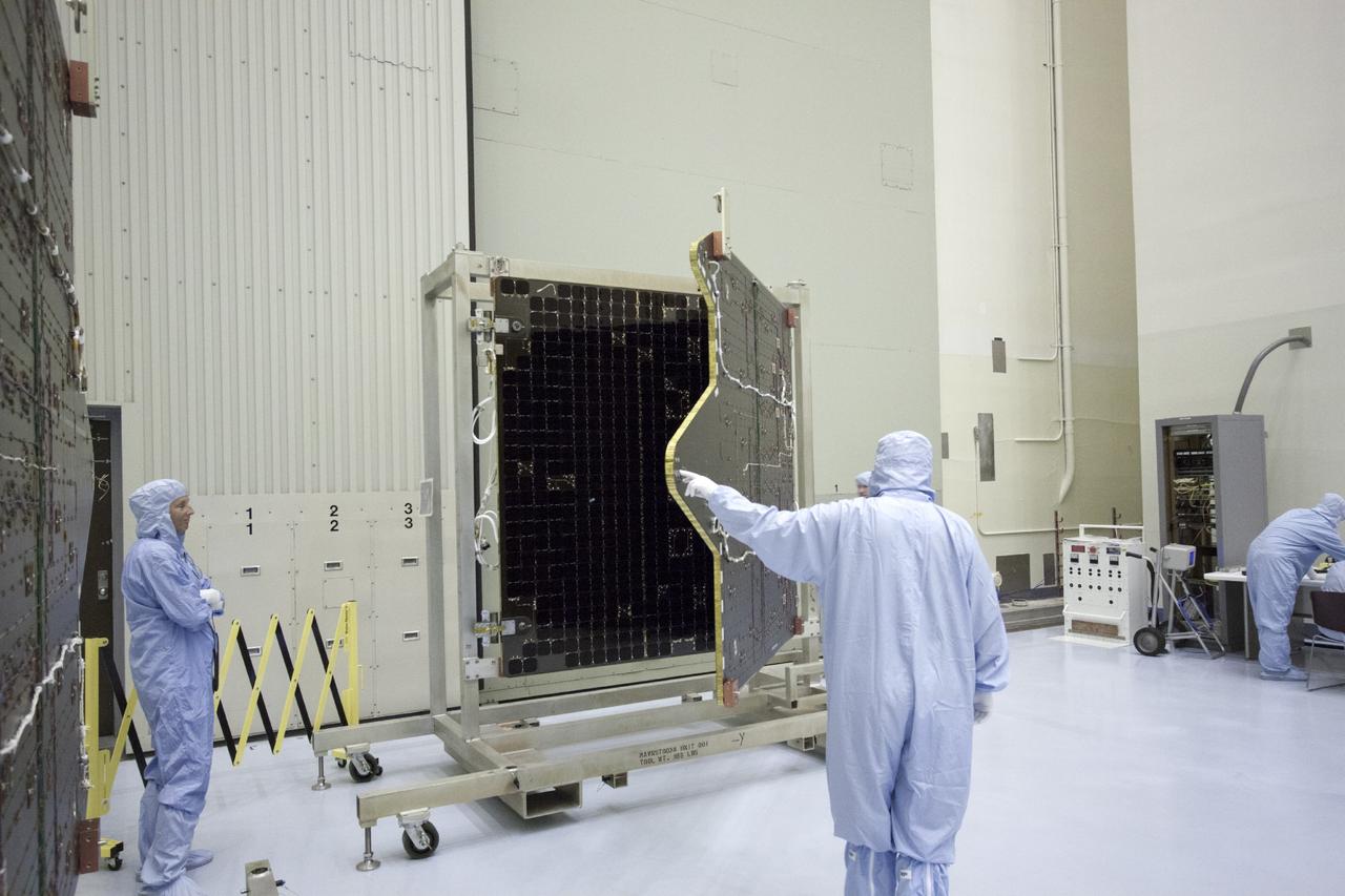 CAPE CANAVERAL, Fla. – Inside the Payload Hazardous Servicing Facility at NASA's Kennedy Space Center in Florida, technicians deploy the solar arrays for the Mars Atmosphere and Volatile Evolution, or MAVEN spacecraft. MAVEN is being prepared inside the facility for its scheduled November launch aboard a United Launch Alliance Atlas V rocket to Mars. Positioned in an orbit above the Red Planet, MAVEN will study the upper atmosphere of Mars in unprecedented detail. Photo credit: NASA/Jim Grossmann