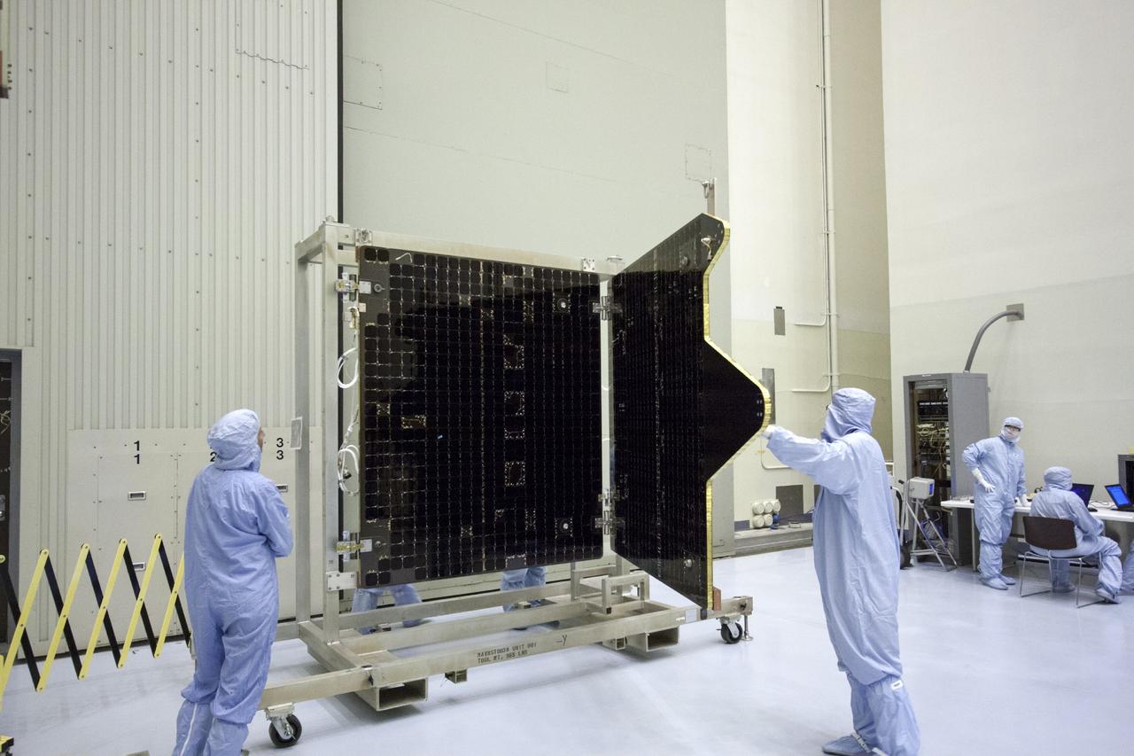 CAPE CANAVERAL, Fla. – Inside the Payload Hazardous Servicing Facility at NASA's Kennedy Space Center in Florida, technicians deploy the solar arrays for the Mars Atmosphere and Volatile Evolution, or MAVEN spacecraft. MAVEN is being prepared inside the facility for its scheduled November launch aboard a United Launch Alliance Atlas V rocket to Mars. Positioned in an orbit above the Red Planet, MAVEN will study the upper atmosphere of Mars in unprecedented detail. Photo credit: NASA/Jim Grossmann