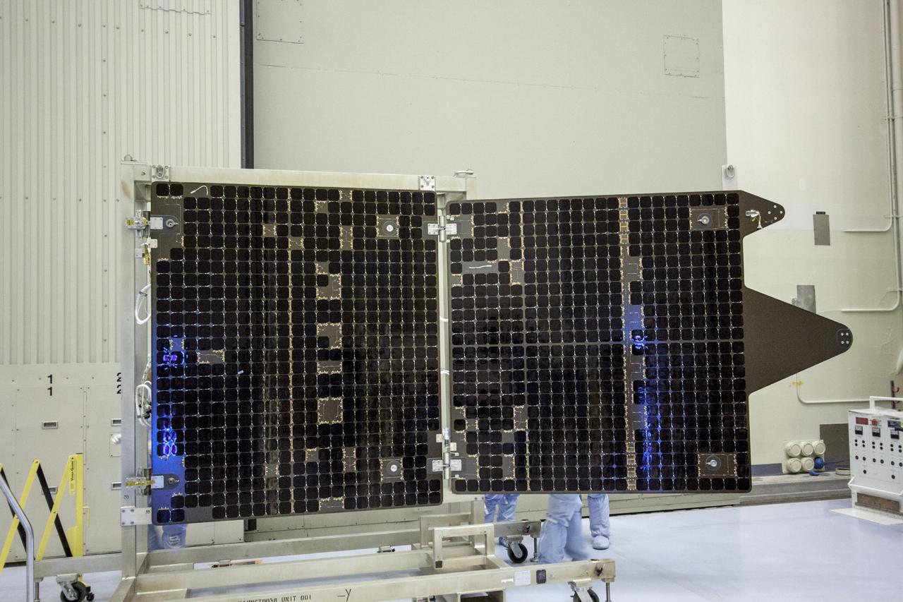 CAPE CANAVERAL, Fla. – Inside the Payload Hazardous Servicing Facility at NASA's Kennedy Space Center in Florida, technicians deploy the solar arrays for the Mars Atmosphere and Volatile Evolution, or MAVEN spacecraft. MAVEN is being prepared inside the facility for its scheduled November launch aboard a United Launch Alliance Atlas V rocket to Mars. Positioned in an orbit above the Red Planet, MAVEN will study the upper atmosphere of Mars in unprecedented detail. Photo credit: NASA/Jim Grossmann