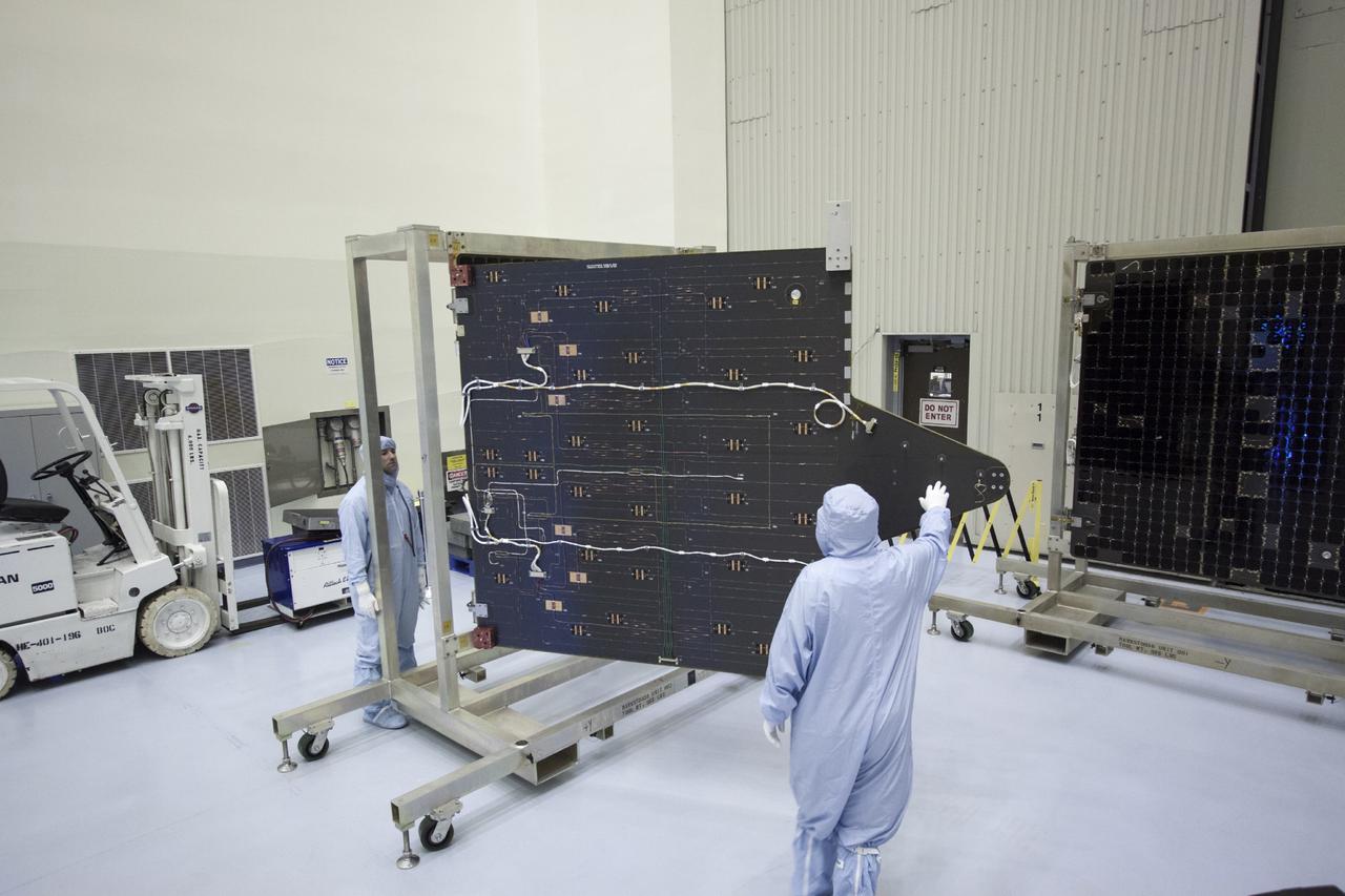 CAPE CANAVERAL, Fla. – Inside the Payload Hazardous Servicing Facility at NASA's Kennedy Space Center in Florida, technicians deploy the solar arrays for the Mars Atmosphere and Volatile Evolution, or MAVEN spacecraft. MAVEN is being prepared inside the facility for its scheduled November launch aboard a United Launch Alliance Atlas V rocket to Mars. Positioned in an orbit above the Red Planet, MAVEN will study the upper atmosphere of Mars in unprecedented detail. Photo credit: NASA/Jim Grossmann