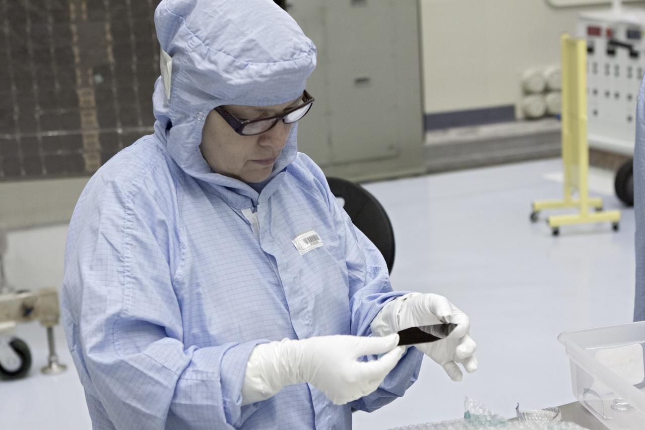 CAPE CANAVERAL, Fla. – Inside the Payload Hazardous Servicing Facility at NASA's Kennedy Space Center in Florida, a technician inspects a cell from one of the electricity-producing solar arrays for the Mars Atmosphere and Volatile Evolution, or MAVEN, spacecraft. MAVEN is being prepared for its scheduled launch in November from Cape Canaveral Air Force Station, Fla. atop a United Launch Alliance Atlas V rocket. Positioned in an orbit above the Red Planet, MAVEN will study the upper atmosphere of Mars in unprecedented detail. For more information, visit: http://www.nasa.gov/mission_pages/maven/main/index.html Photo credit: NASA/Jim Grossmann MAVEN is being prepared inside the facility for its scheduled November launch aboard a United Launch Alliance Atlas V rocket to Mars. Positioned in an orbit above the Red Planet, MAVEN will study the upper atmosphere of Mars in unprecedented detail. Photo credit: NASA/Jim Grossmann