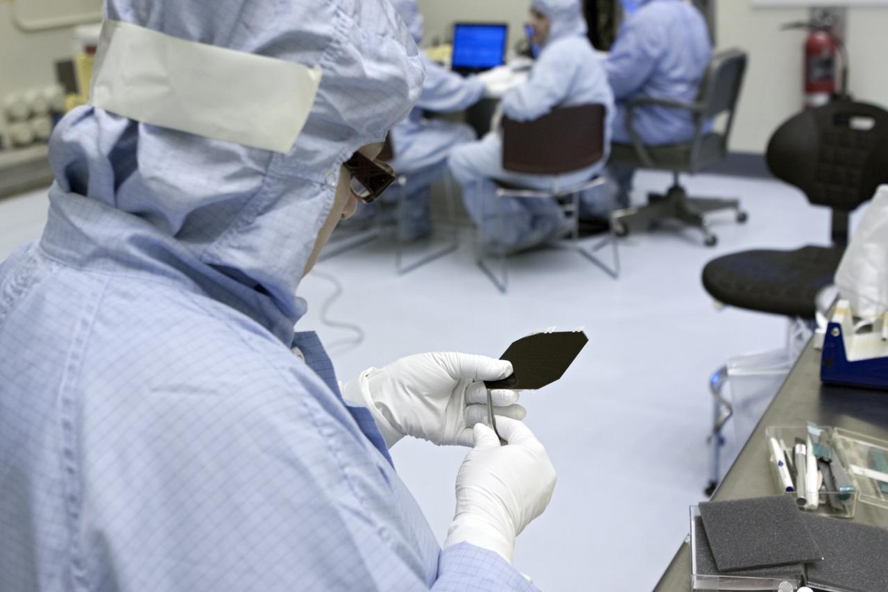 CAPE CANAVERAL, Fla. – Inside the Payload Hazardous Servicing Facility at NASA's Kennedy Space Center in Florida, a technician inspects a cell from one of the electricity-producing solar arrays for the Mars Atmosphere and Volatile Evolution, or MAVEN, spacecraft. MAVEN is being prepared for its scheduled launch in November from Cape Canaveral Air Force Station, Fla. atop a United Launch Alliance Atlas V rocket. Positioned in an orbit above the Red Planet, MAVEN will study the upper atmosphere of Mars in unprecedented detail. For more information, visit: http://www.nasa.gov/mission_pages/maven/main/index.html Photo credit: NASA/Jim Grossmann MAVEN is being prepared inside the facility for its scheduled November launch aboard a United Launch Alliance Atlas V rocket to Mars. Positioned in an orbit above the Red Planet, MAVEN will study the upper atmosphere of Mars in unprecedented detail. Photo credit: NASA/Jim Grossmann