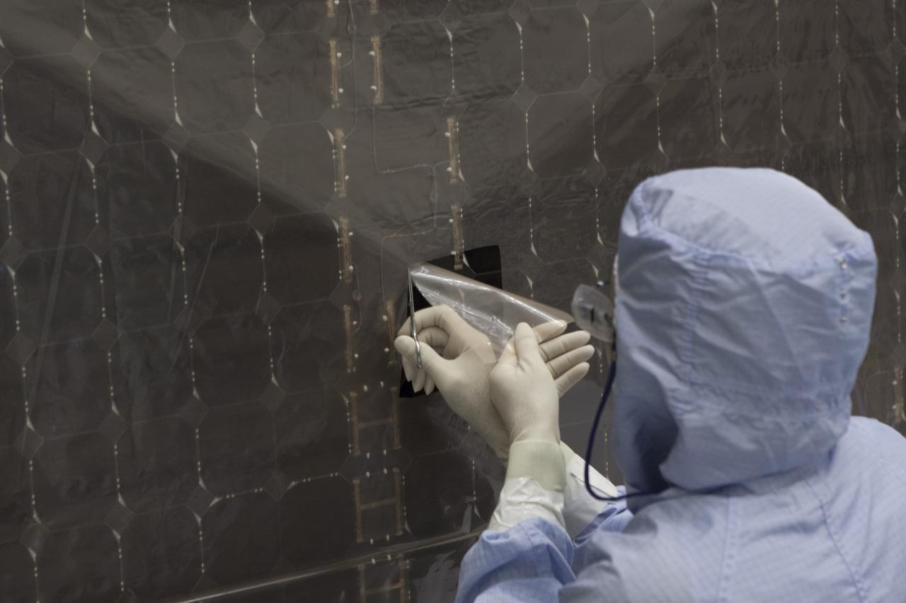 CAPE CANAVERAL, Fla. – Inside the Payload Hazardous Servicing Facility at NASA's Kennedy Space Center in Florida, a technician repairs a cell from one of the electricity-producing solar arrays for the Mars Atmosphere and Volatile Evolution, or MAVEN, spacecraft. MAVEN is being prepared for its scheduled launch in November from Cape Canaveral Air Force Station, Fla. atop a United Launch Alliance Atlas V rocket. Positioned in an orbit above the Red Planet, MAVEN will study the upper atmosphere of Mars in unprecedented detail. For more information, visit: http://www.nasa.gov/mission_pages/maven/main/index.html Photo credit: NASA/Jim Grossmann MAVEN is being prepared inside the facility for its scheduled November launch aboard a United Launch Alliance Atlas V rocket to Mars. Positioned in an orbit above the Red Planet, MAVEN will study the upper atmosphere of Mars in unprecedented detail. Photo credit: NASA/Jim Grossmann