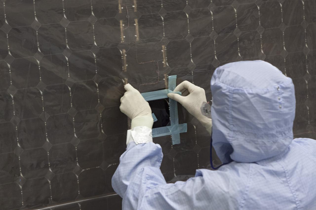 CAPE CANAVERAL, Fla. – Inside the Payload Hazardous Servicing Facility at NASA's Kennedy Space Center in Florida, a technician repairs a cell from one of the electricity-producing solar arrays for the Mars Atmosphere and Volatile Evolution, or MAVEN, spacecraft. MAVEN is being prepared for its scheduled launch in November from Cape Canaveral Air Force Station, Fla. atop a United Launch Alliance Atlas V rocket. Positioned in an orbit above the Red Planet, MAVEN will study the upper atmosphere of Mars in unprecedented detail. For more information, visit: http://www.nasa.gov/mission_pages/maven/main/index.html Photo credit: NASA/Jim Grossmann MAVEN is being prepared inside the facility for its scheduled November launch aboard a United Launch Alliance Atlas V rocket to Mars. Positioned in an orbit above the Red Planet, MAVEN will study the upper atmosphere of Mars in unprecedented detail. Photo credit: NASA/Jim Grossmann