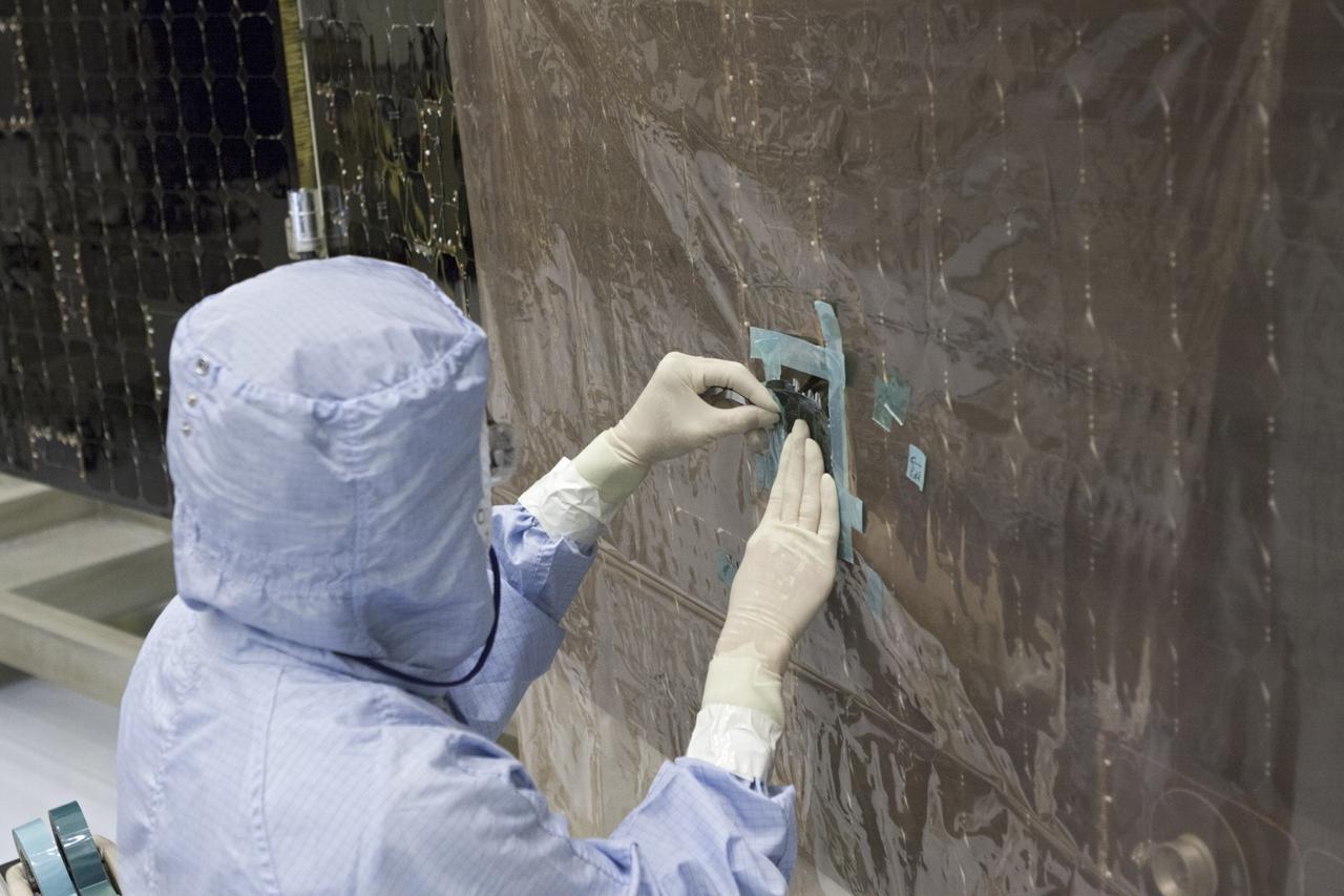 CAPE CANAVERAL, Fla. – Inside the Payload Hazardous Servicing Facility at NASA's Kennedy Space Center in Florida, a technician repairs a cell from one of the electricity-producing solar arrays for the Mars Atmosphere and Volatile Evolution, or MAVEN, spacecraft. MAVEN is being prepared for its scheduled launch in November from Cape Canaveral Air Force Station, Fla. atop a United Launch Alliance Atlas V rocket. Positioned in an orbit above the Red Planet, MAVEN will study the upper atmosphere of Mars in unprecedented detail. For more information, visit: http://www.nasa.gov/mission_pages/maven/main/index.html Photo credit: NASA/Jim Grossmann MAVEN is being prepared inside the facility for its scheduled November launch aboard a United Launch Alliance Atlas V rocket to Mars. Positioned in an orbit above the Red Planet, MAVEN will study the upper atmosphere of Mars in unprecedented detail. Photo credit: NASA/Jim Grossmann