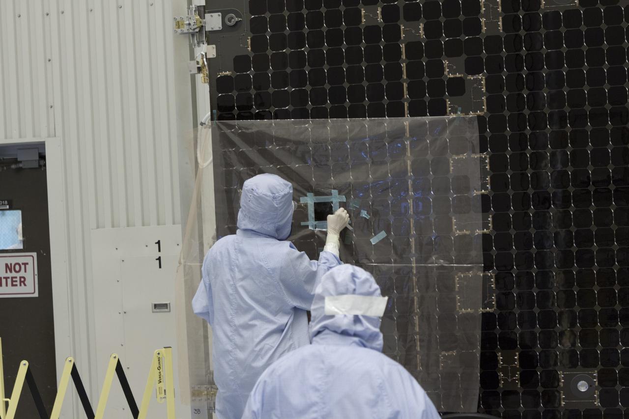 CAPE CANAVERAL, Fla. – Inside the Payload Hazardous Servicing Facility at NASA's Kennedy Space Center in Florida, a technician repairs a cell from one of the electricity-producing solar arrays for the Mars Atmosphere and Volatile Evolution, or MAVEN, spacecraft. MAVEN is being prepared for its scheduled launch in November from Cape Canaveral Air Force Station, Fla. atop a United Launch Alliance Atlas V rocket. Positioned in an orbit above the Red Planet, MAVEN will study the upper atmosphere of Mars in unprecedented detail. For more information, visit: http://www.nasa.gov/mission_pages/maven/main/index.html Photo credit: NASA/Jim Grossmann MAVEN is being prepared inside the facility for its scheduled November launch aboard a United Launch Alliance Atlas V rocket to Mars. Positioned in an orbit above the Red Planet, MAVEN will study the upper atmosphere of Mars in unprecedented detail. Photo credit: NASA/Jim Grossmann